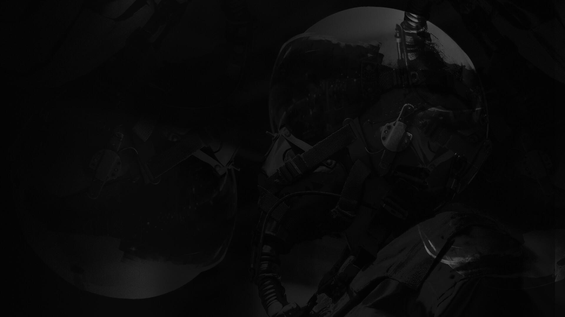 A dark, abstract image featuring overlapping mechanical components and tubes, creating a mysterious and industrial atmosphere.
