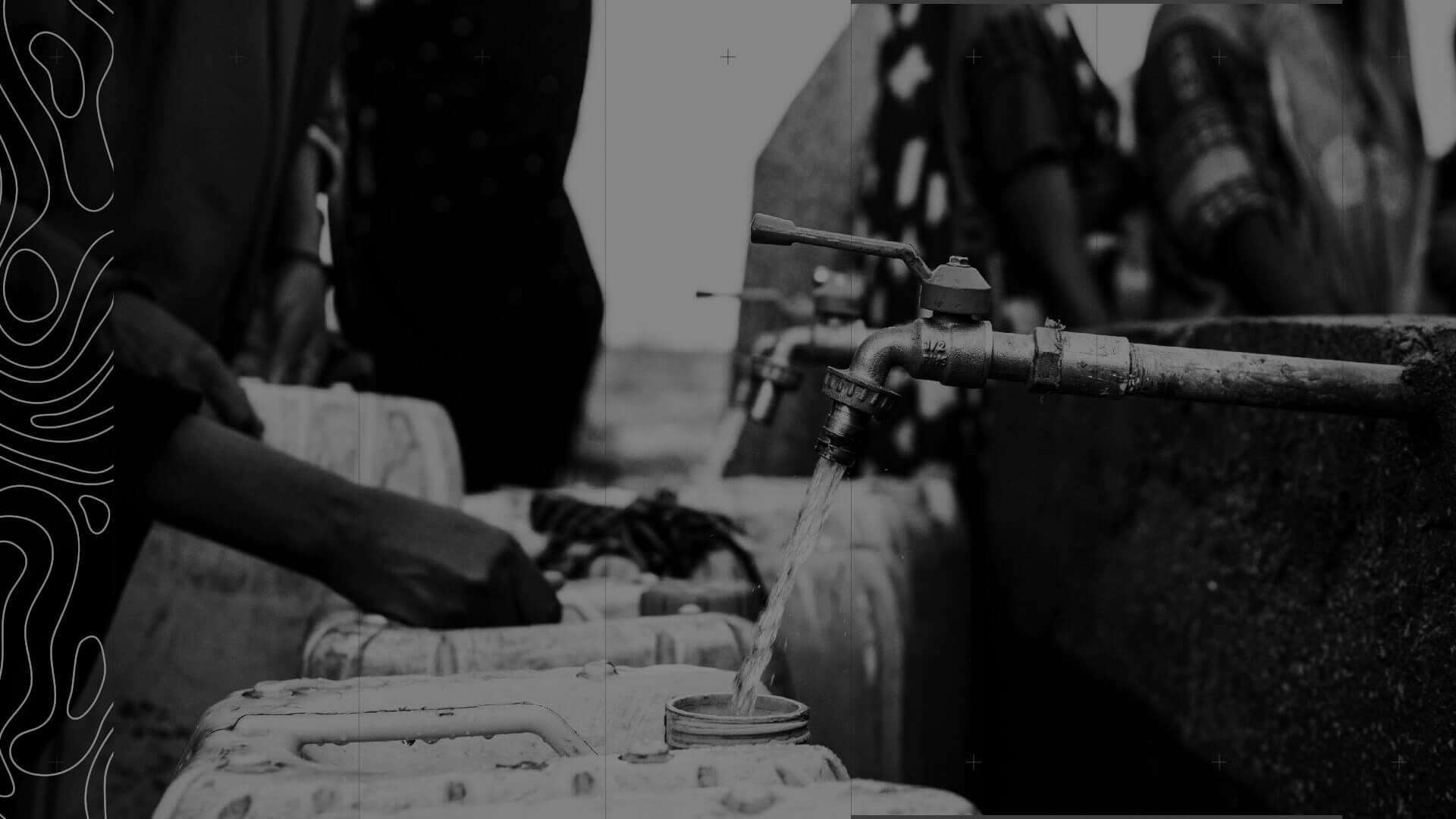 A black and white image of people filling containers with water from a faucet, with hands visible and a textured pattern on the left side.
